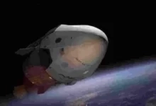 A SpaceX Dragon spacecraft orbiting Earth, captured in vivid detail against space.
