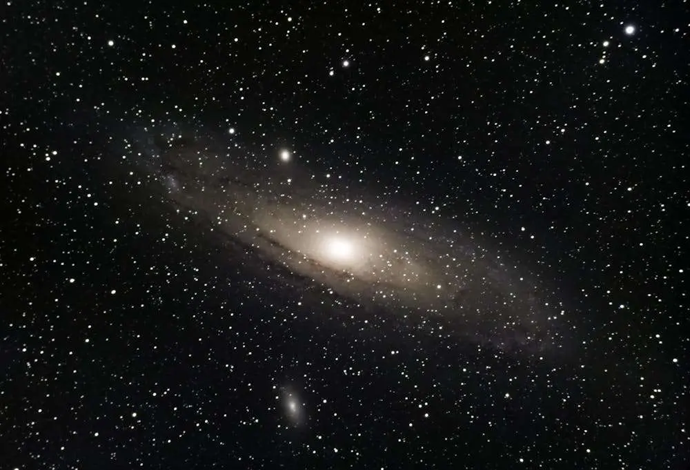 Stunning view of the Andromeda Galaxy surrounded by countless stars in outer space.
