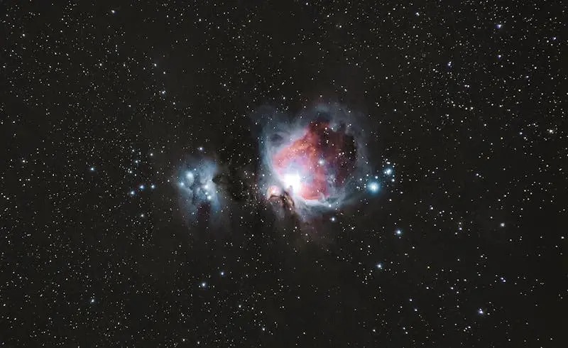 A breathtaking photograph of the Orion Nebula amidst a starry night sky, capturing celestial beauty.